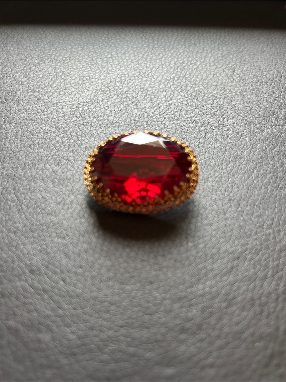 Gold-Tone Brooch with Faceted Red Gemstone